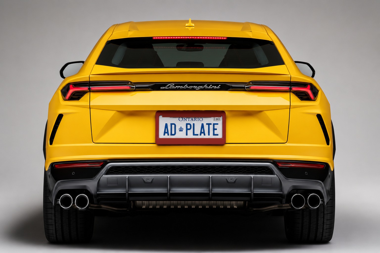 Rear of a Lamborghini Urus with an Ontario licence plate inside a red AdPlate advertising frame